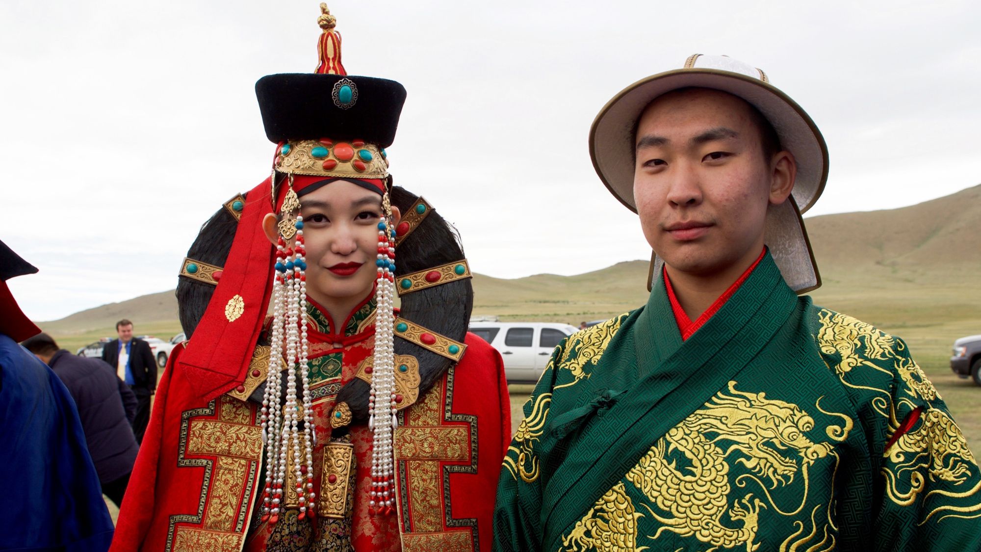 A newly wed couple wearing Mongolian Deel, showcasing Asian fashion tapestry