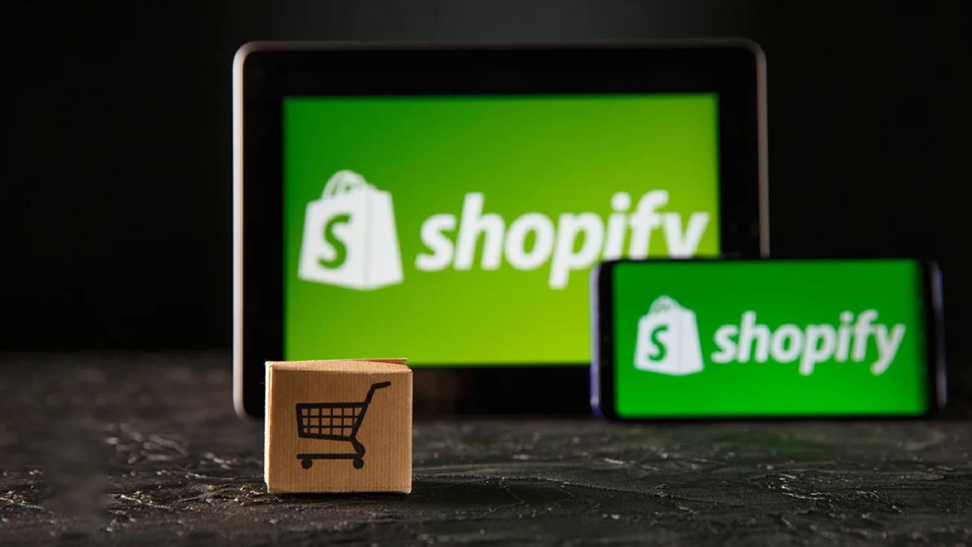 A tablet & phone with Shopify store partner logo