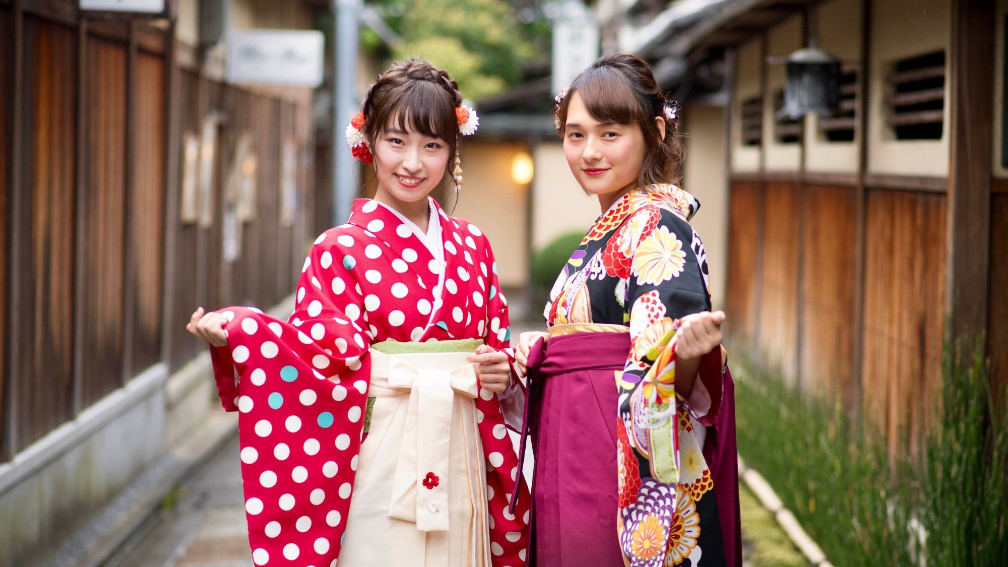 Two Japanese girls showcasing Asian fashion tapestry